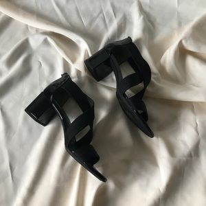 Black patent and elastic heels by Bandolino
